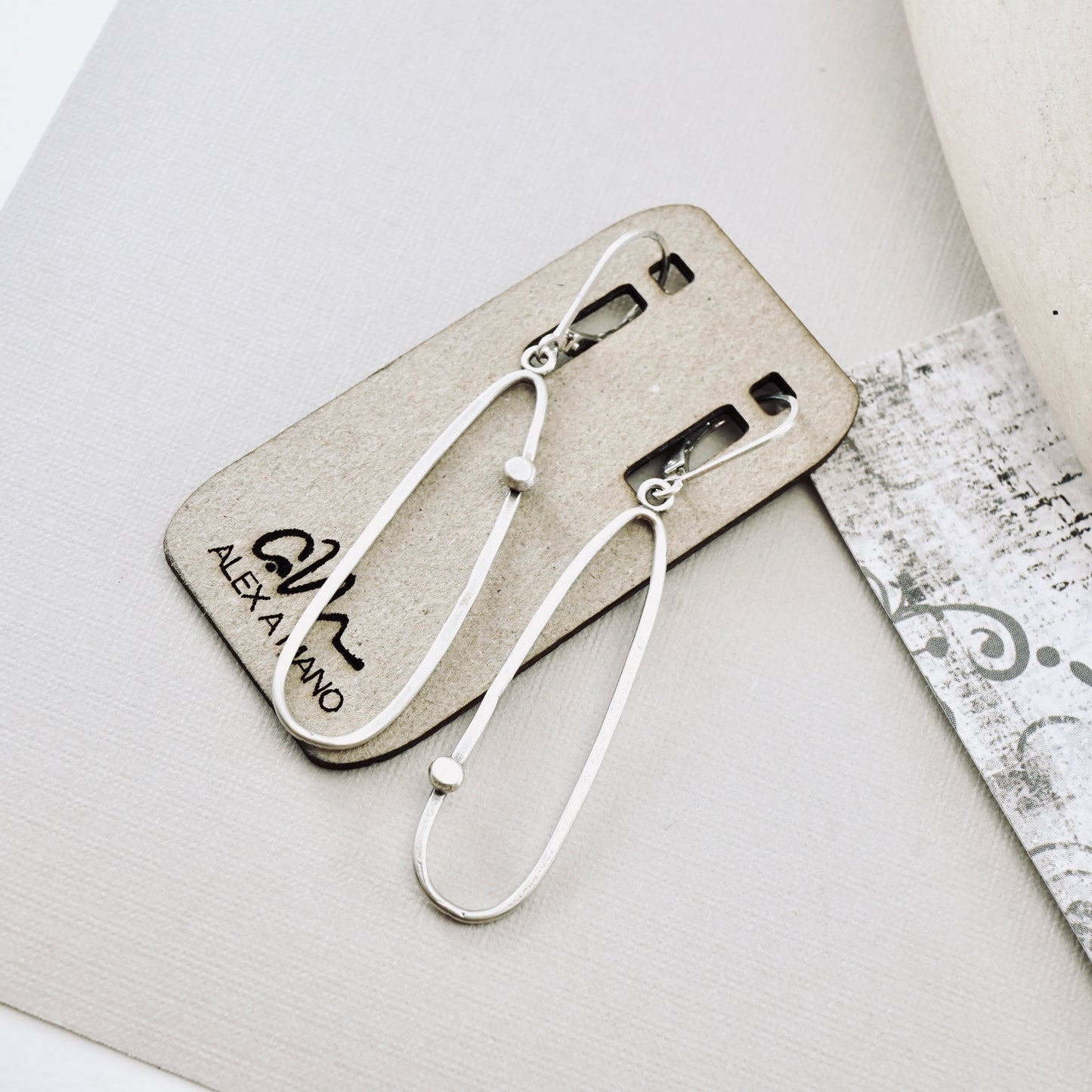 Offset Dot Elongated Loop Earrings