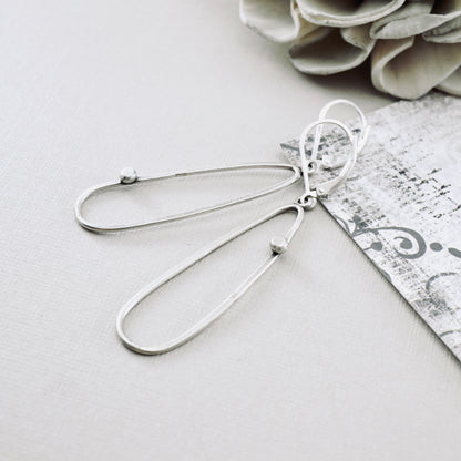 Offset Dot Elongated Loop Earrings