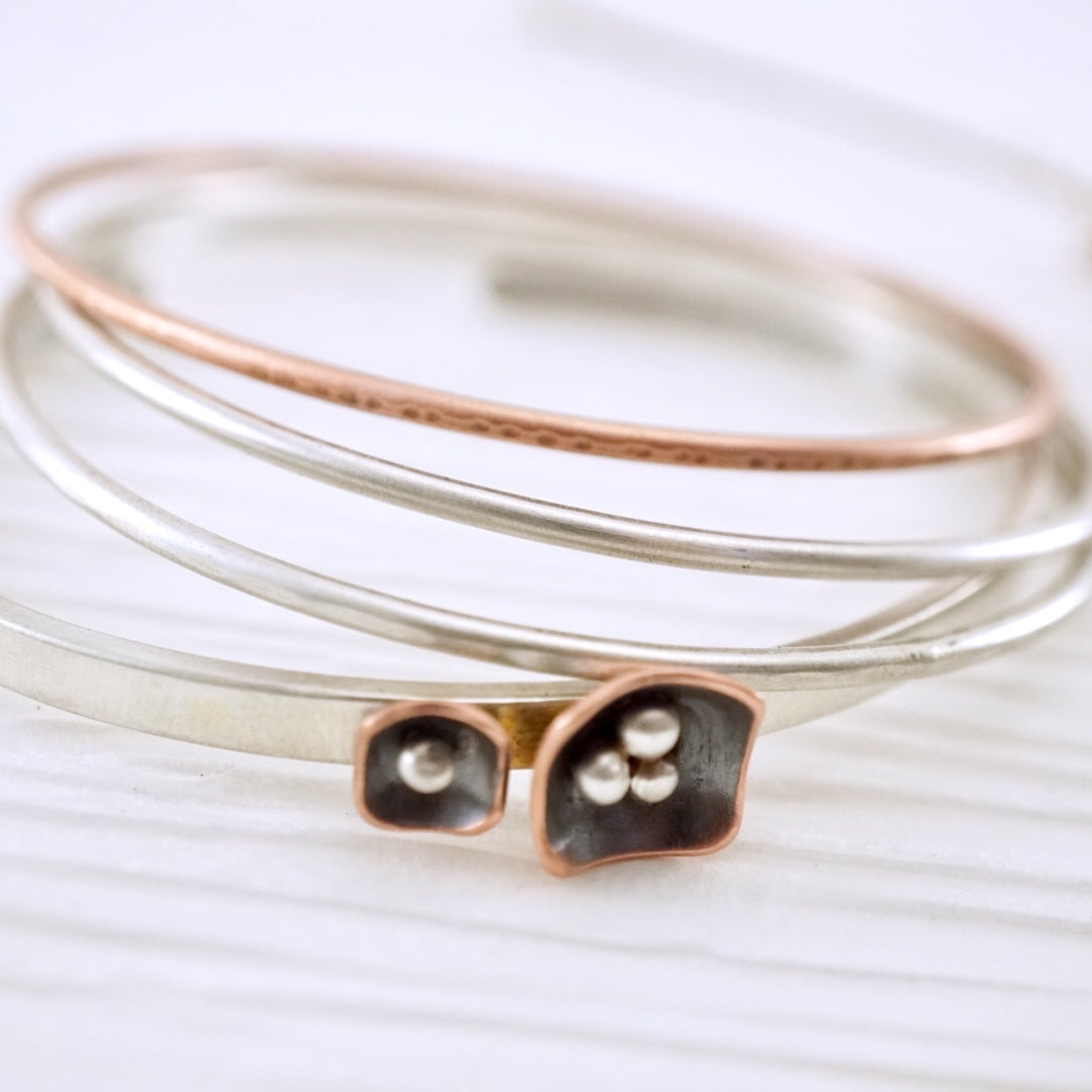 Unique, artisan designed, handmade sterling silver and copper cuff bracelet | Square Pods collection